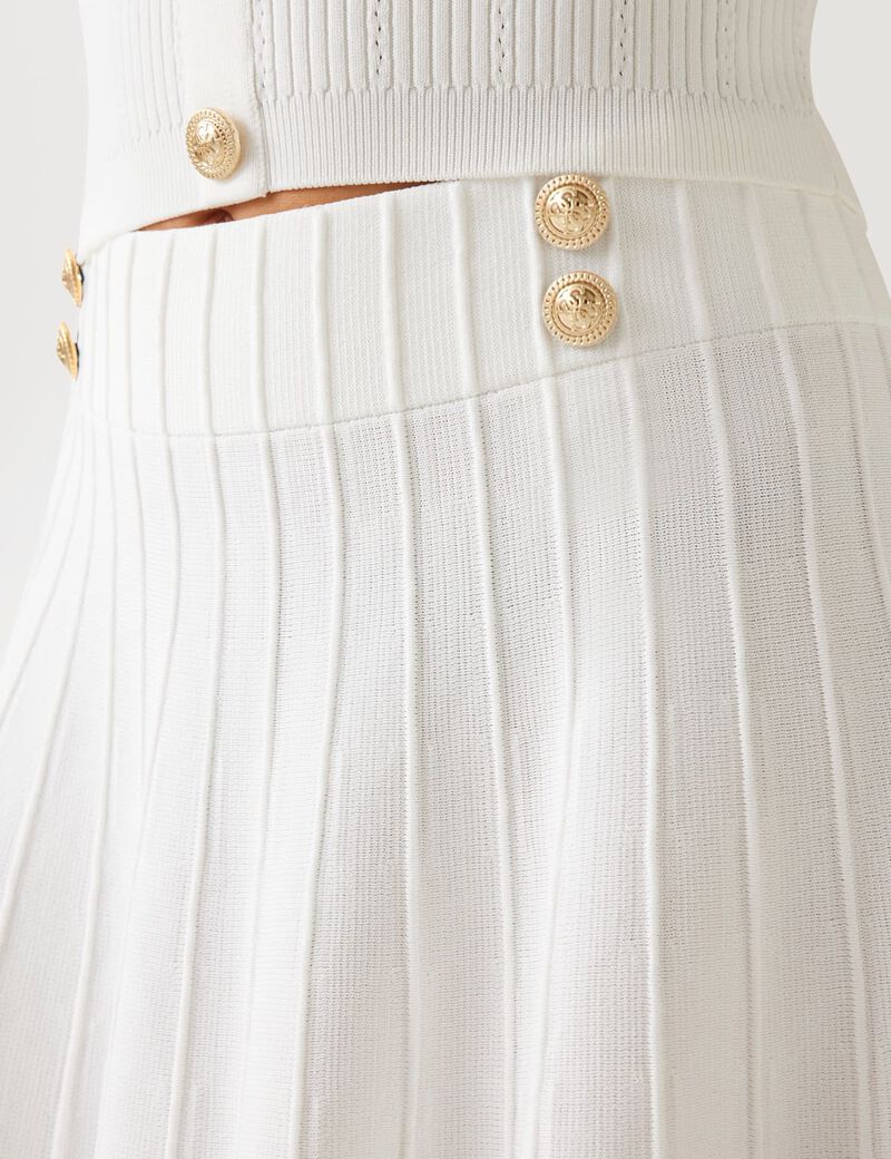 Pleated mini sweater skirt