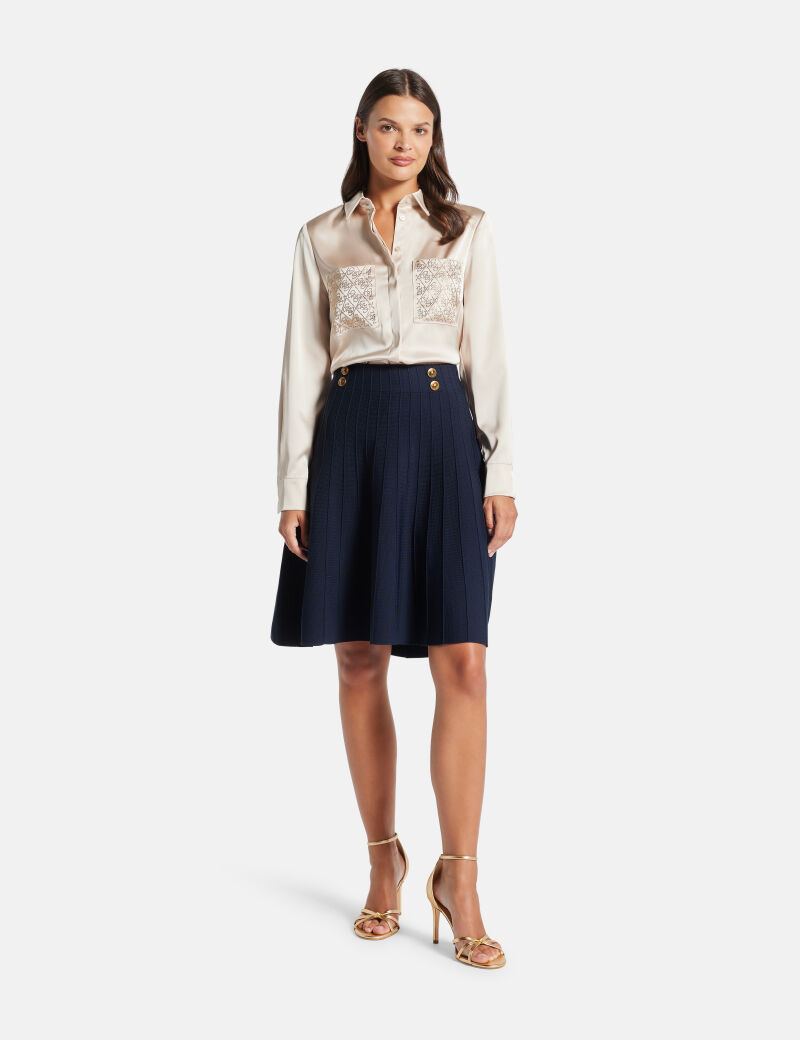 Pleated mini sweater skirt